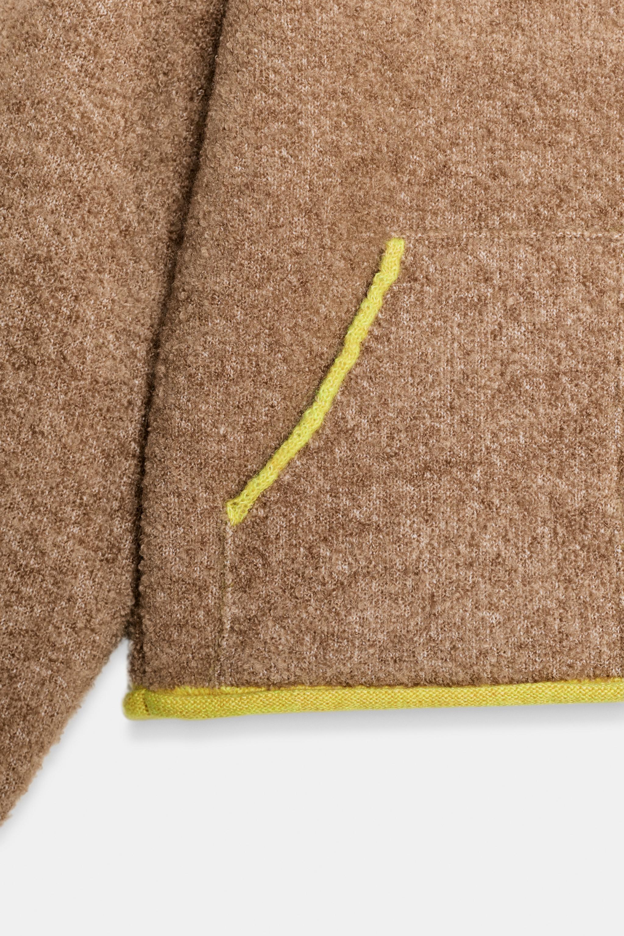 GILET EN MAILLE À FINITIONS CONTRASTANTES